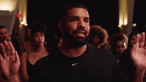 A Man With A Beard Is Wearing A Nike Shirt GIF