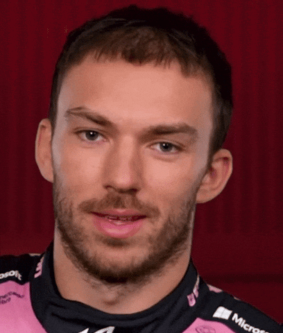 A Man With A Beard Is Wearing A Pink Shirt That Says Microsoft On It GIF