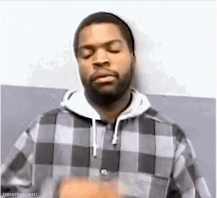 A Man With A Beard Is Wearing A Plaid Shirt And A Hat . GIF