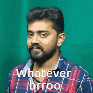 A Man With A Beard Is Wearing A Plaid Shirt And Says Whatever Brioo . GIF