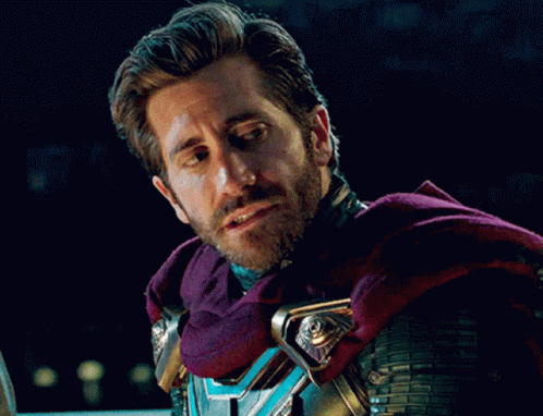 A Man With A Beard Is Wearing A Purple Cape And Armor GIF