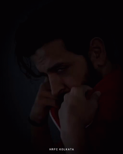 A Man With A Beard Is Wearing A Red Jacket And The Word Kolkata Is On The Bottom GIF