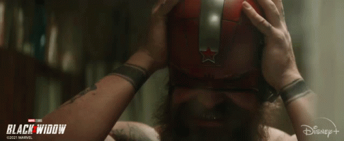 Man With Beard Wearing Red Mask And Silver Star GIF