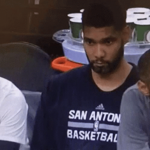 A Man With A Beard Is Wearing A San Anton Basketball Shirt GIF