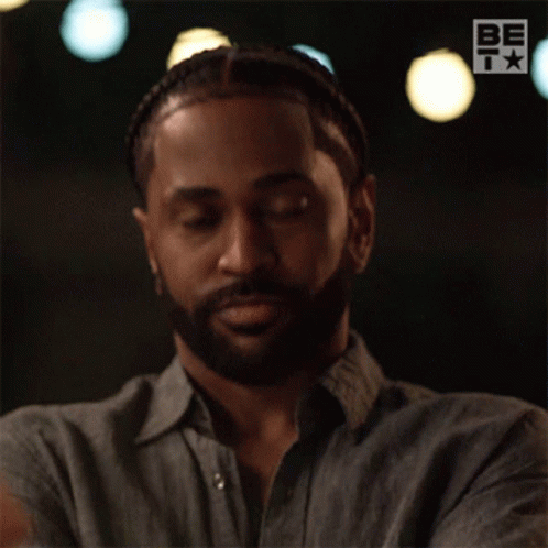 A Man With A Beard Is Wearing A Shirt That Says Be On The Bottom GIF