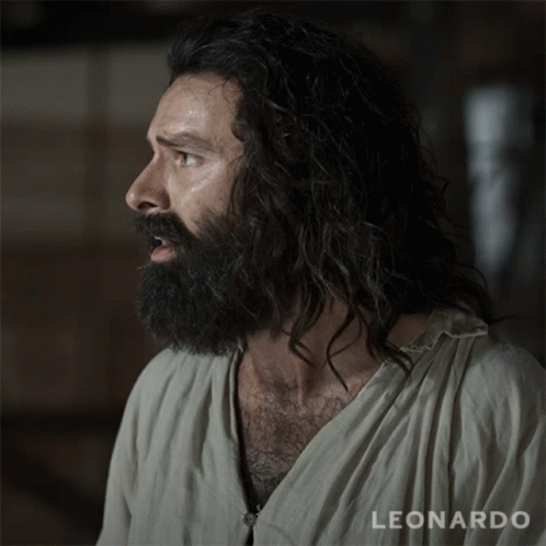 A Man With A Beard Is Wearing A Shirt That Says Leonardo On It GIF