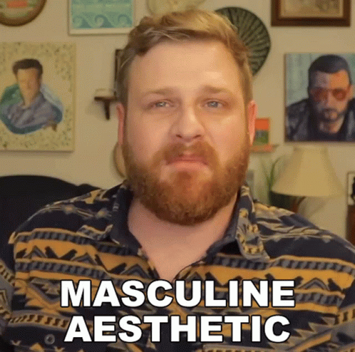 A Man With A Beard Is Wearing A Shirt That Says Masculine Aesthetic On It GIF