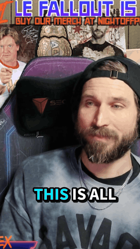 a man with a beard is wearing a shirt that says savag on it
