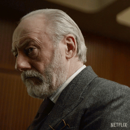 Man With Beard In Suit And Netflix Logo GIF