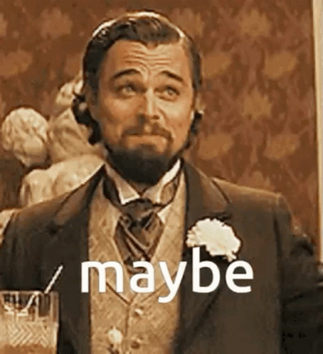 A Man With A Beard Is Wearing A Suit And Tie And Holding A Glass Of Wine . GIF