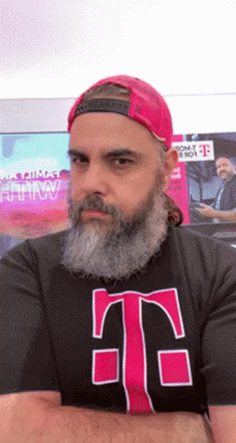 A Man With A Beard Is Wearing A T-Mobile T-Shirt GIF