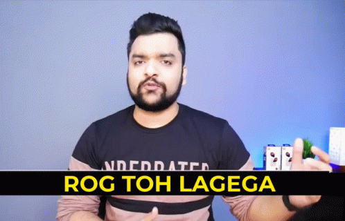 A Man With A Beard Is Wearing A T-Shirt That Says " Rog Toh Lagega " GIF