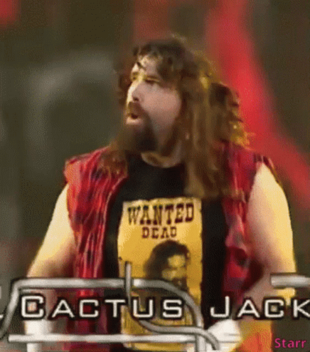 A Man With A Beard Is Wearing A Wanted Dead T-Shirt GIF