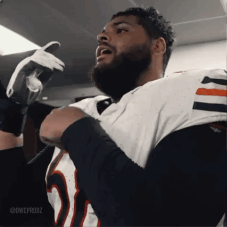 A Man With A Beard Is Wearing A White Jersey With The Number 25 On It GIF