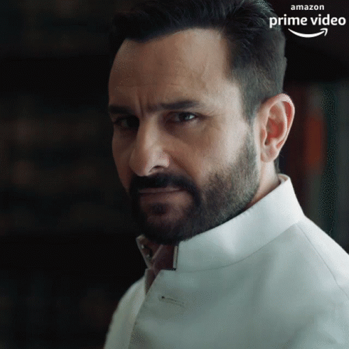 A Man With A Beard Is Wearing A White Shirt That Says Amazon Prime Video On The Bottom GIF