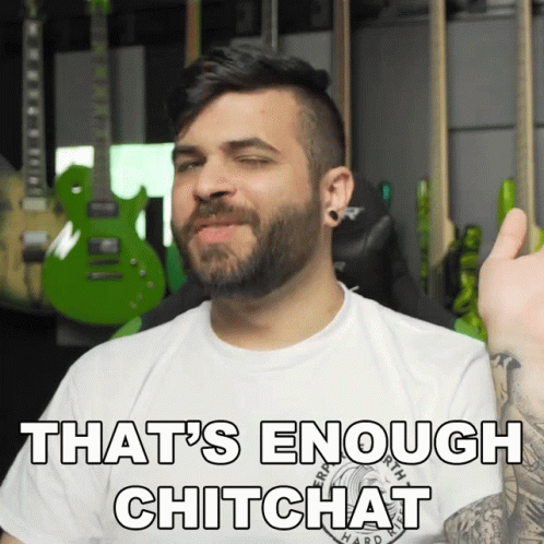A Man With A Beard Is Wearing A White Shirt That Says That 'S Enough Chitchat On It GIF