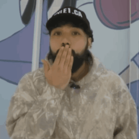 A Man With A Beard Is Wearing A White Sweatshirt With The Word Supreme On It GIF