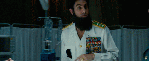 Man In U.S. Navy Uniform Sitting At Desk GIF