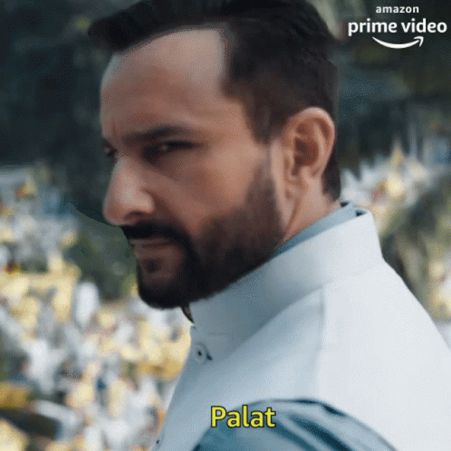 A Man With A Beard Is Wearing A White Vest And Has The Word Palat Written On His Chest GIF