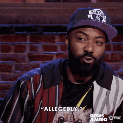 A Man With A Beard Is Wearing A Yankees Hat And Says Allegedly GIF