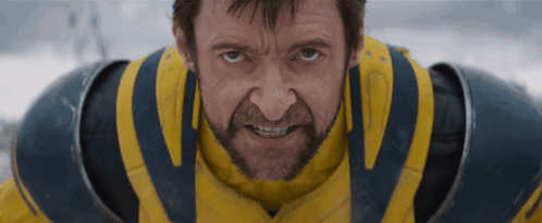 A Man With A Beard Is Wearing A Yellow And Blue Armor GIF