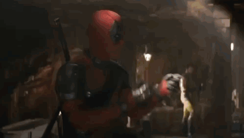 A Man With A Beard Is Wearing A Yellow And Blue Jacket And Saying Let 'S Fucking Go . GIF