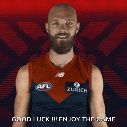 A Man With A Beard Is Wearing An Afl Jersey And Says Good Luck !!! Enjoy The Game . GIF