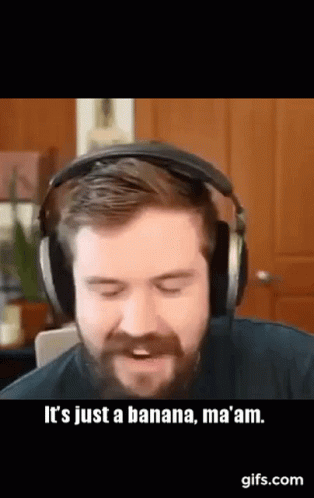 A Man With A Beard Is Wearing Headphones And Saying It 'S Just A Banana , Ma Am . GIF