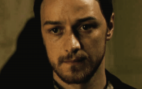A Man With A Beard Looks At The Camera With His Eyes Closed GIF