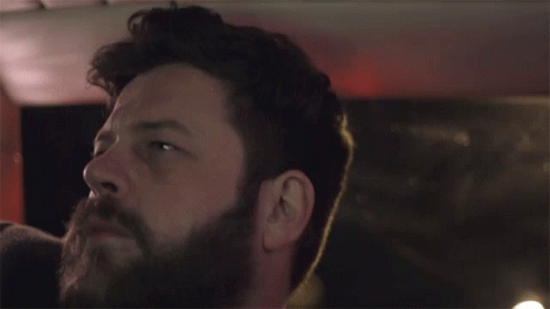 Man With Beard Looking Up In Darkness GIF