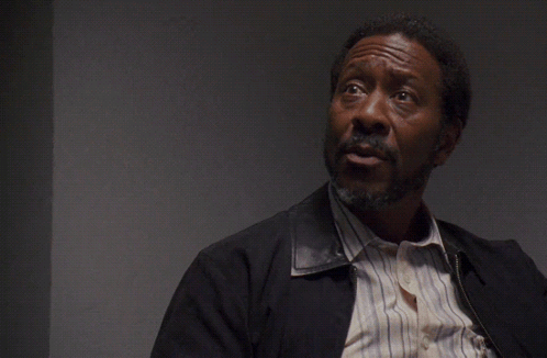 A Man With A Beard Looks Up At The Words No One Cares GIF