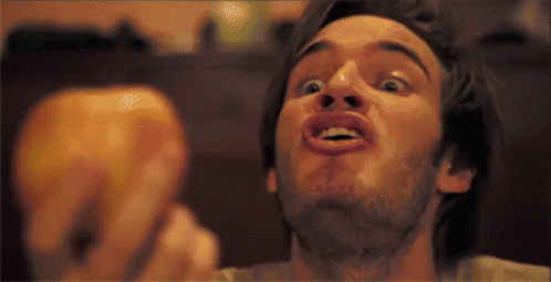 A Man With A Beard Making A Funny Face With His Mouth Open GIF