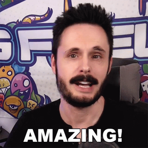 Man With Beard Saying Amazing In Front Of Graffiti GIF