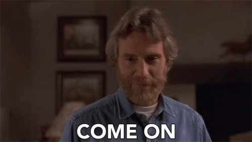 A Man With A Beard Says Come On In A Living Room GIF