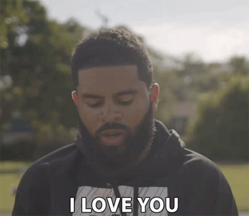 A Man With A Beard Says " I Love You " With His Eyes Closed GIF