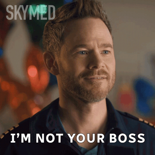 A Man With A Beard Says " I 'M Not Your Boss " In Front Of Balloons GIF