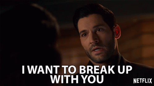 A Man With A Beard Says " I Want To Break Up With You " In Front Of A Woman GIF