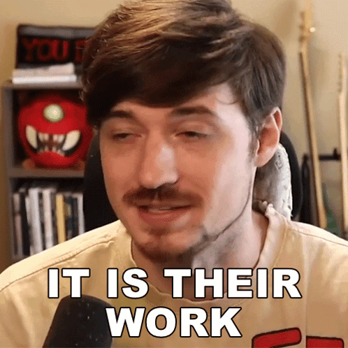 A Man With A Beard Says It Is Their Work In Front Of A Microphone GIF