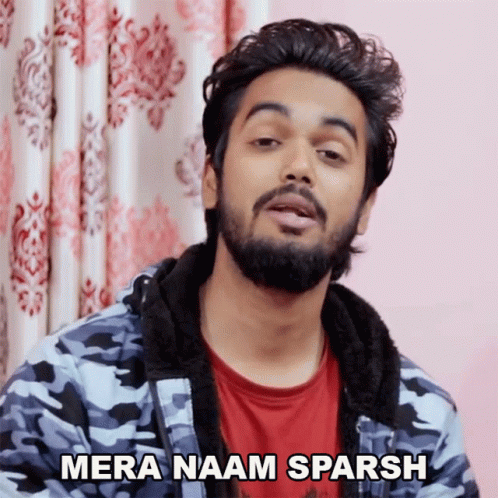 A Man With A Beard Says Mera Naam Sparsh In Front Of A Pink Curtain GIF
