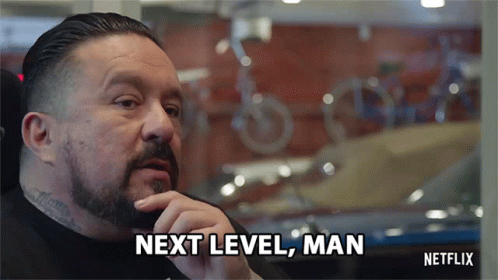 A Man With A Beard Says Next Level Man In Front Of A Window GIF