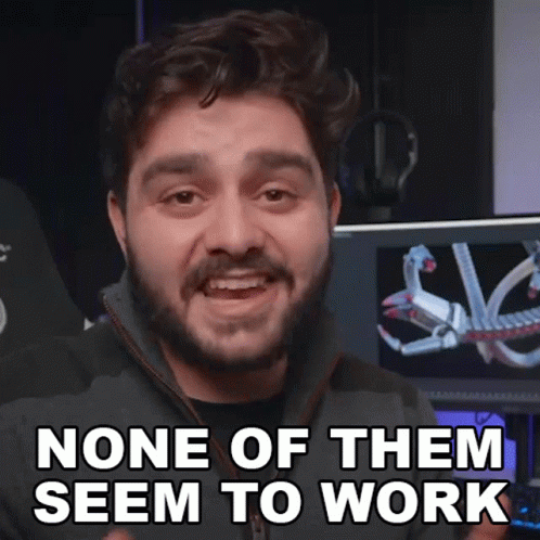 A Man With A Beard Says " None Of Them Seem To Work " In Front Of A Computer Monitor GIF