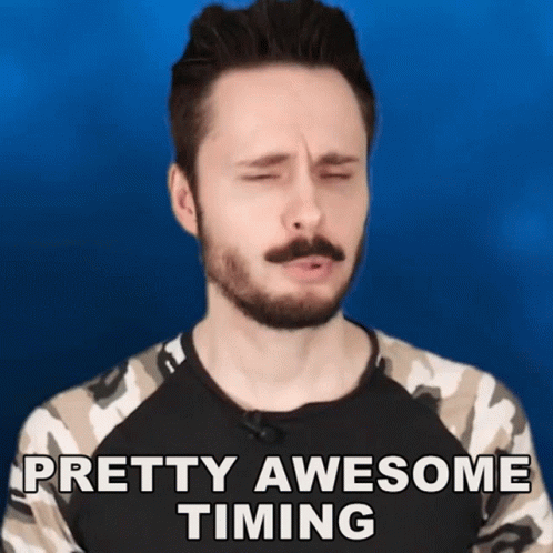 a man with a beard says pretty awesome timing with his eyes closed