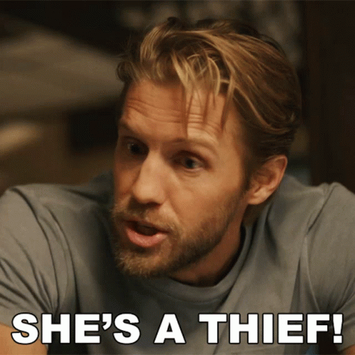 A Man With A Beard Says She 'S A Thief In White Letters GIF