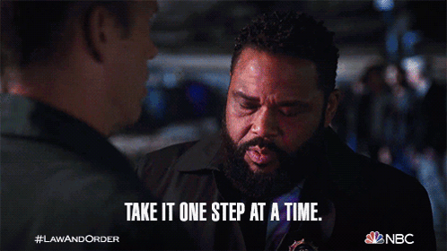 A Man With A Beard Says Take It One Step At A Time While Talking To Another Man GIF