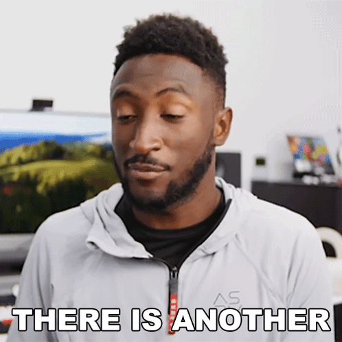 A Man With A Beard Says There Is Another While Wearing A White Jacket GIF