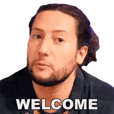 a man with a beard says welcome in front of his face