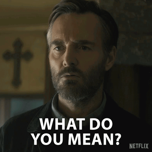 A Man With A Beard Says " What Do You Mean " In Front Of A Cross GIF
