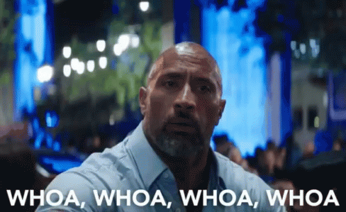 A Man With A Beard Says Whoa Whoa Whoa Whoa In Front Of A Blurry Background GIF