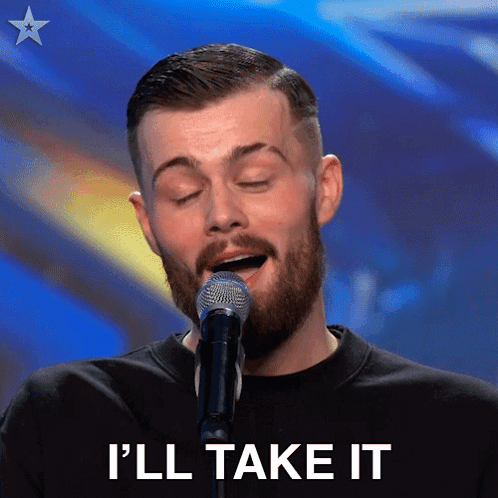 A Man With A Beard Singing Into A Microphone With The Words I 'Ll Take It Below Him GIF