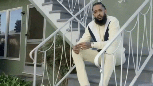 Man Sitting On White Stairs GIF